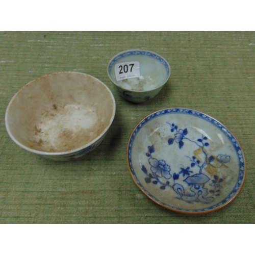 207 - An oriental tea bowl, saucer and one other bowl.