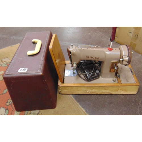 240 - Cased singer sewing machine.