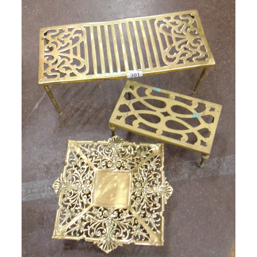 301 - Brass rectangular kettle stand and two other examples.