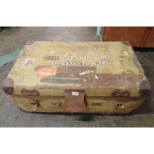 319 - Canvas travel trunk, having original labels.