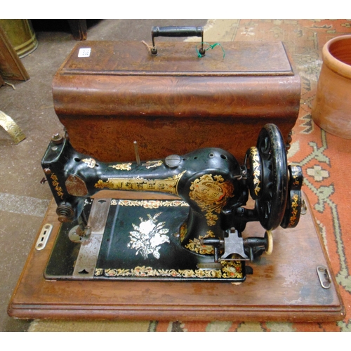 335 - Antique cased Jones sewing machine.