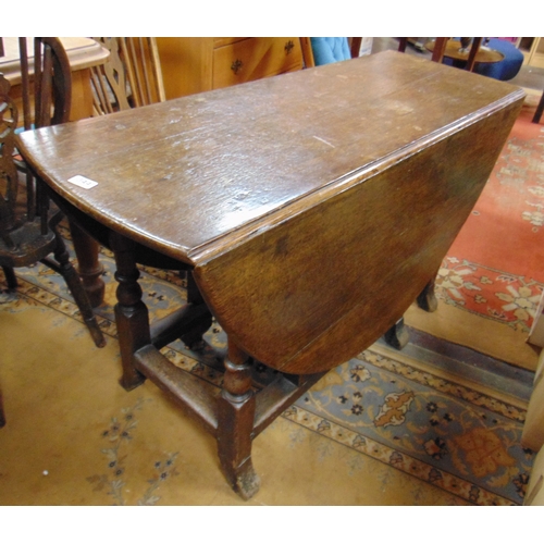 344 - Antique oak gateleg table, drop leaves, set on mushroom cap supports and splayed feet, 28 x 49 x 18