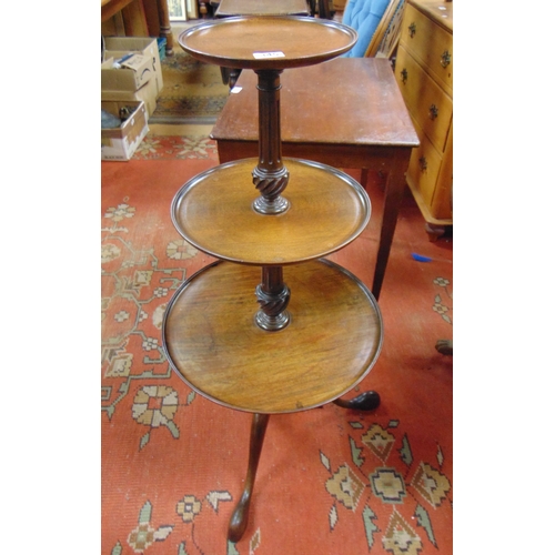 345 - Reproduction mahogany graduated three tier dumb waiter, set on fluted turned column and down swept s... 