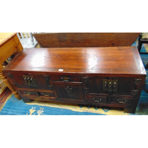 359 - An Oriental side cabinet, having drawers and cupboards to base, with metal handles, 22 x 51 x 16.5