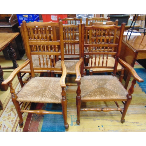 364 - Set of eight elm spindle back rush seated chairs. (6 + 2)