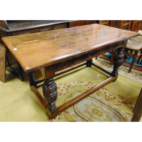 370 - Good reproduction oak refectory table, rectangular top having cleated ends, carved frieze above cup ... 