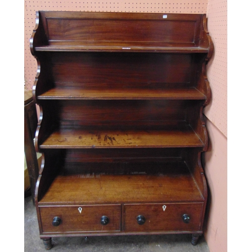 386 - Regency mahogany waterfall bookcase, four graduated shelves above pair of  drawers with knob handles... 