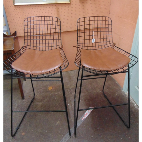 388 - In the manner of Harry Bertoia, pair of wire work bar stools.