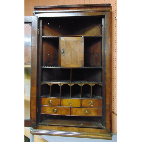 393 - Good antique walnut corner cupboard, ogive cornice above single glazed door enclosing drawers and pi... 