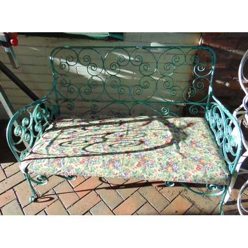 404 - Shaped metal garden bench and two chairs.