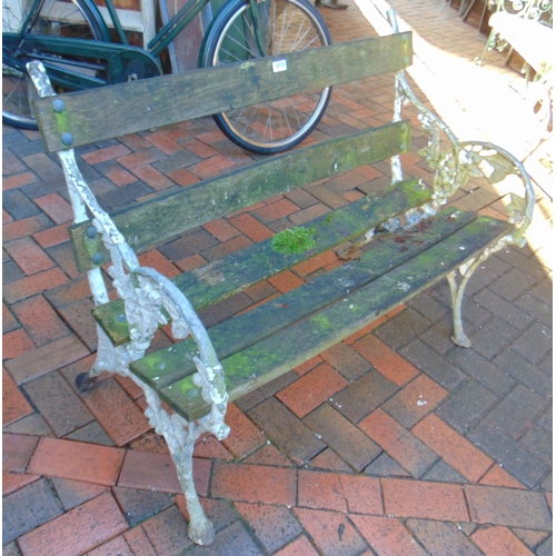 418 - Wooden slatted garden bench, having foliate shaped metal decoration, 40