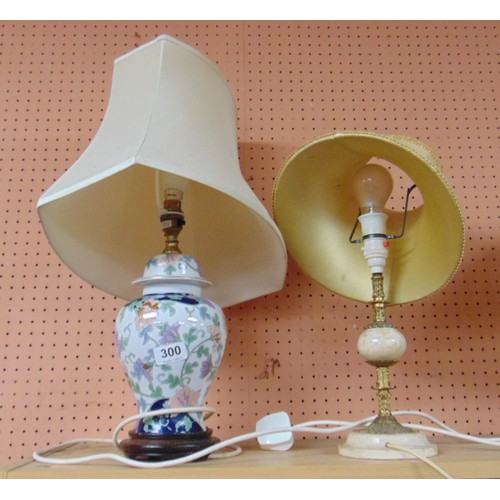 300 - Floral decorated table lamp and one other example.