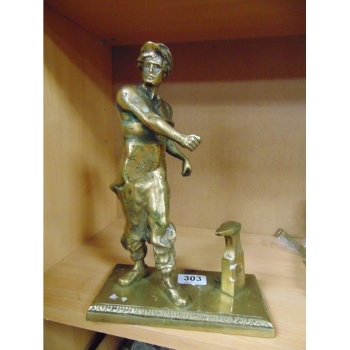 303 - Brass figure modelled as a blacksmith, 12.5