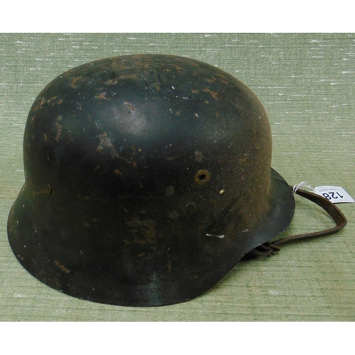 128 - German 2nd World War steel helmet with inner liner.