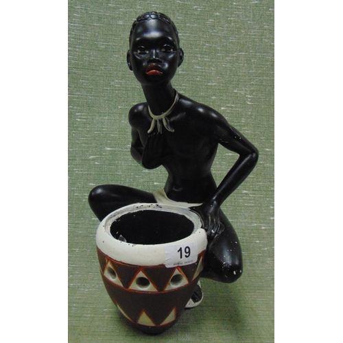 19 - Painted chalk figure of an African man and drum, 14