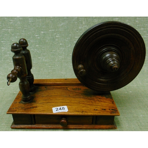 248 - Antique table top wool winder, having single drawer to base.