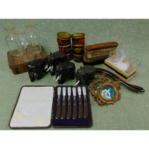 281 - Four ebony elephants, three chemist jars, etc.