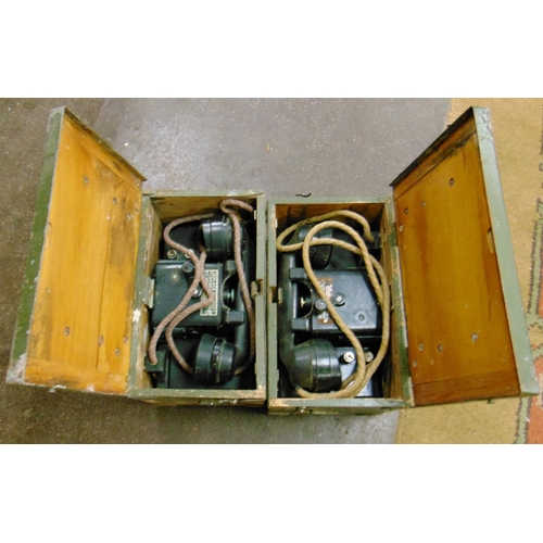 315 - Two cased field telephones.