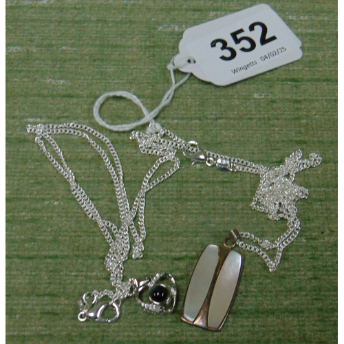 352 - Two silver chains and pendants.