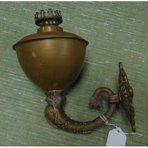 45 - Brass sea serpent form wall mounted oil lamp.