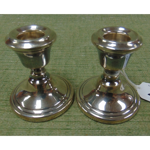 47 - Pair of filled silver squat candlesticks, maker Hampton Utilities, Birmingham 1978.