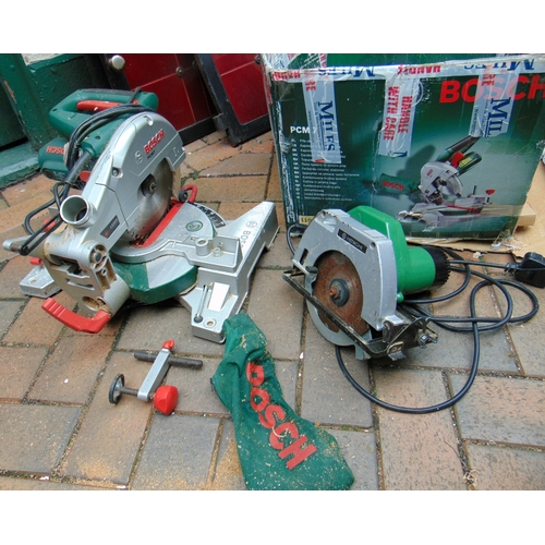 Boxed Bosch PCM 7 mitre saw, having adjustable laser beam and dust bag ...