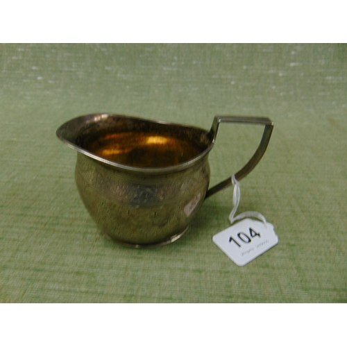 104 - Antique silver cream jug, having gilt interior and loop handle, London 1886, 4.1 ozt.