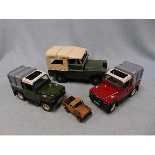 Box of model Land Rovers.