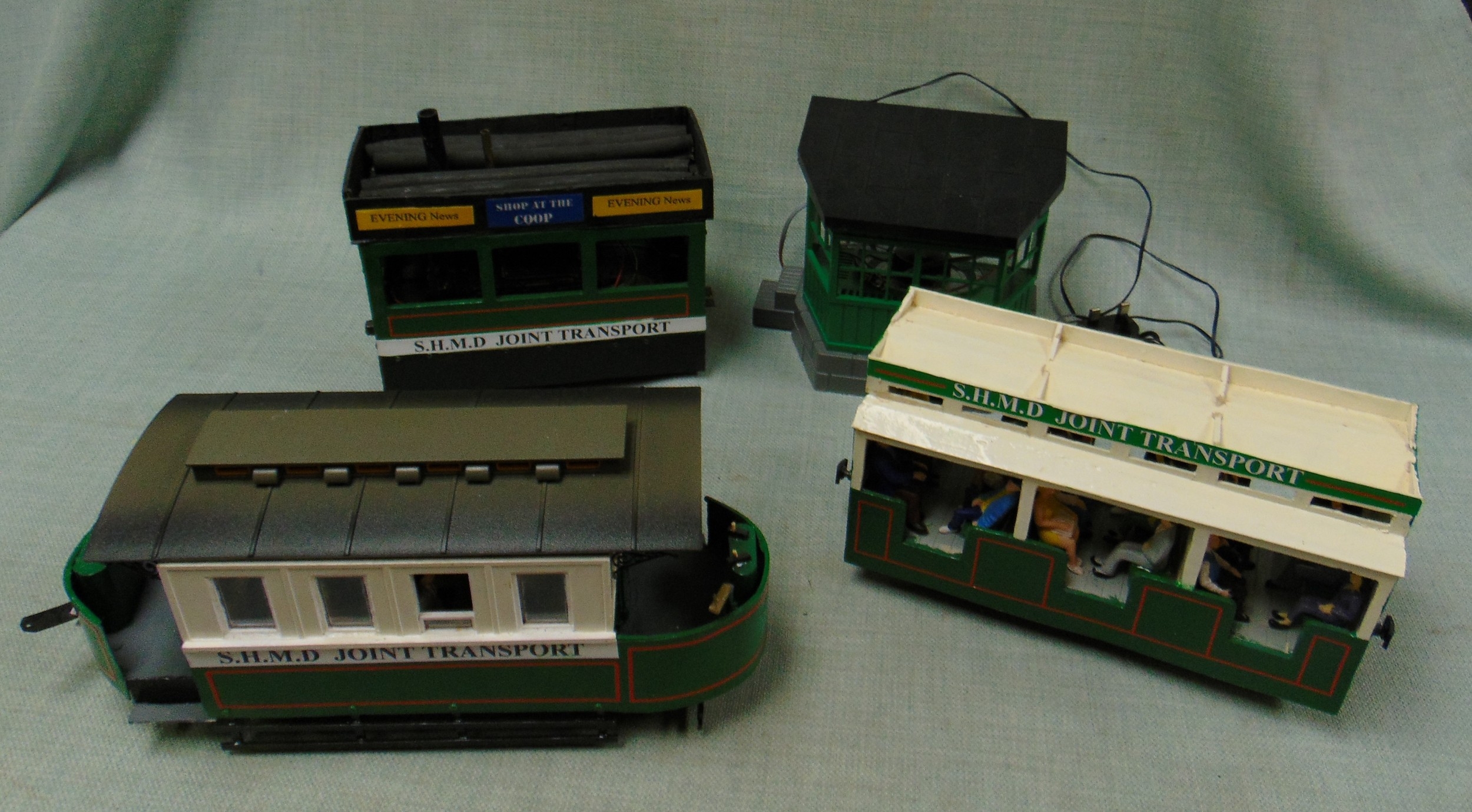Three scratch built model trams, with engines.