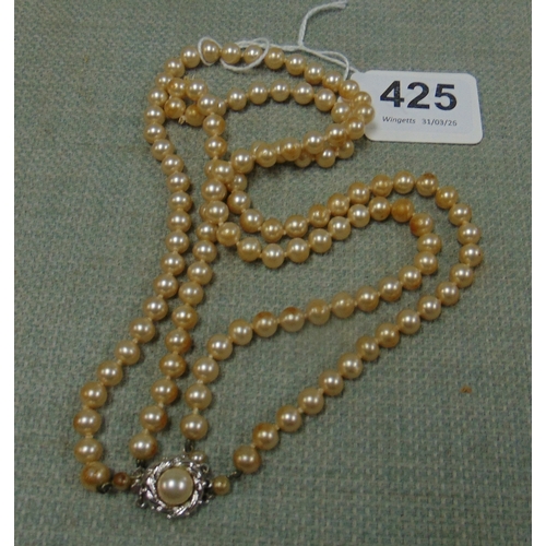 Two string pearl necklace.
