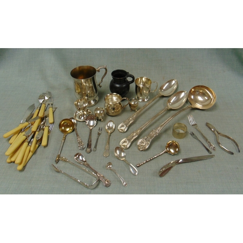 61 - Plated kings pattern ladle, serving spoon and some other cutlery.