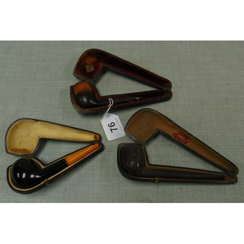 76 - Three cased tobacco pipes.