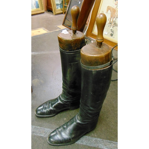 82 - Pair of antique boot trees, boots and a shooting stick.