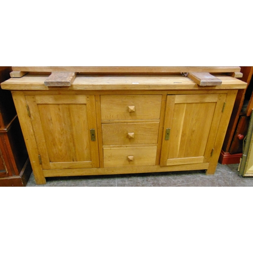 388 - Contemporary oak sideboard, rectangular top over three central drawers flanked by cupboard doors, 31... 