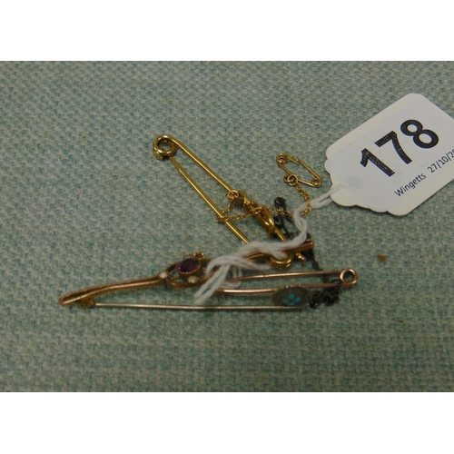 Two 9ct gold brooches and one other example.