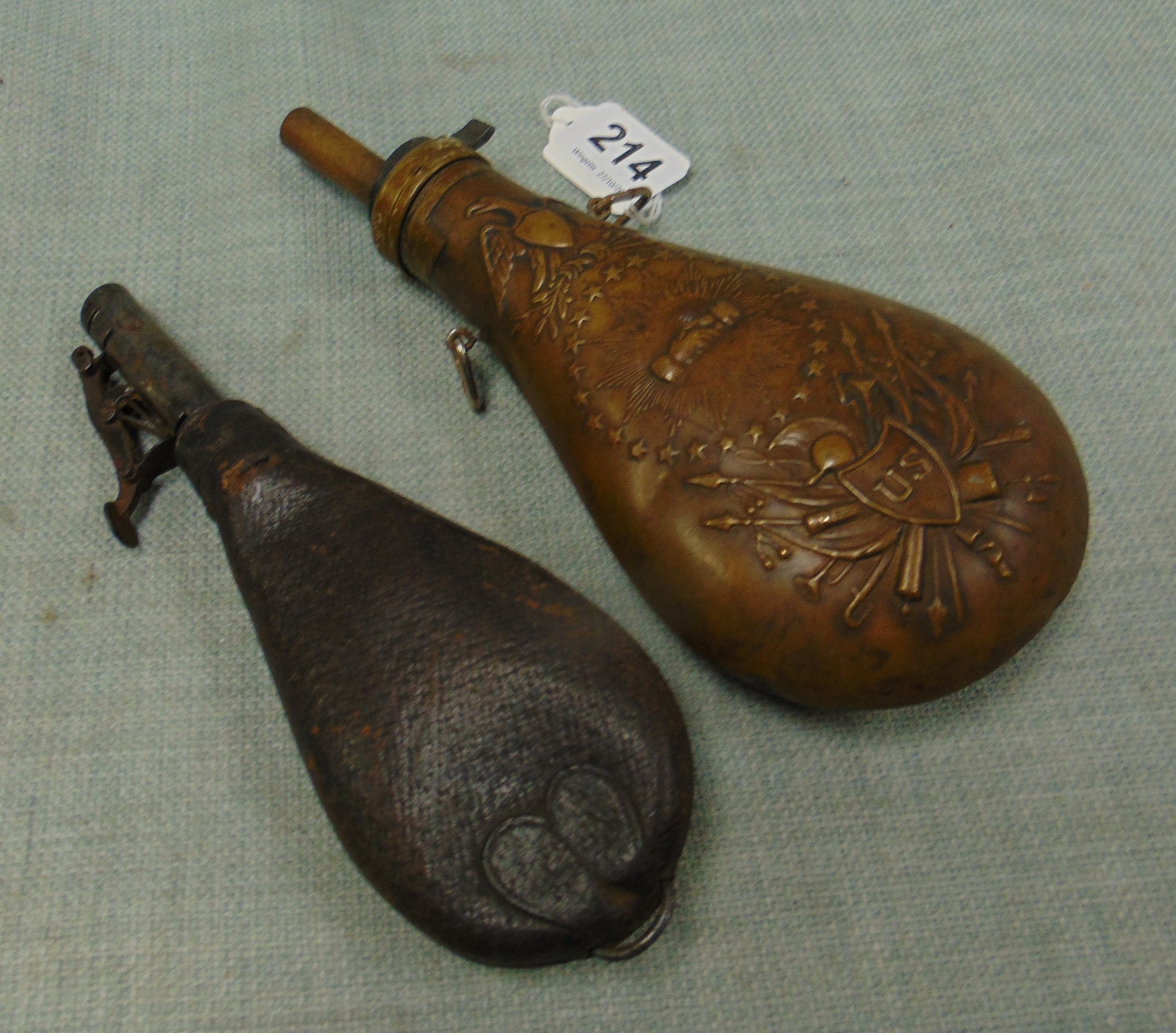 Antique powder flask and a later example.