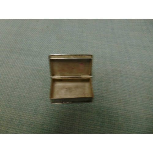 Silver book form stamp holder, having engraved decoration.