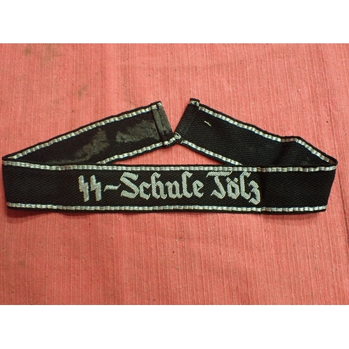 190 - WW2 German SS Schule-Tolz cuff title

FINELY WOVEN ALUMINIUM WIRE WORK SCRIPT. FOLDED AND STITCHED E... 