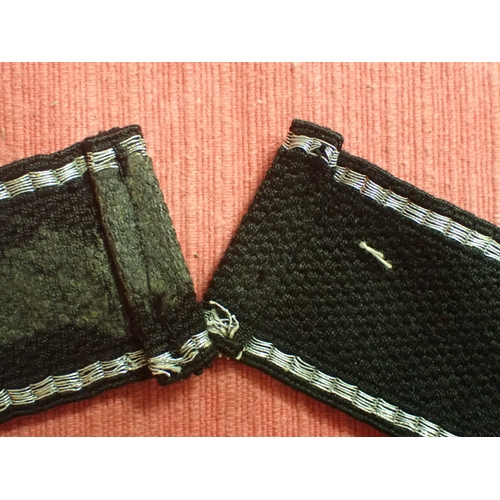 190 - WW2 German SS Schule-Tolz cuff title

FINELY WOVEN ALUMINIUM WIRE WORK SCRIPT. FOLDED AND STITCHED E... 