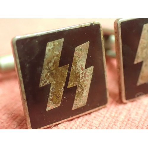 198 - WW2 German, Pair of SS cufflinks

Rare private purchase cufflinks. Nickel-silver with black enamel. ... 