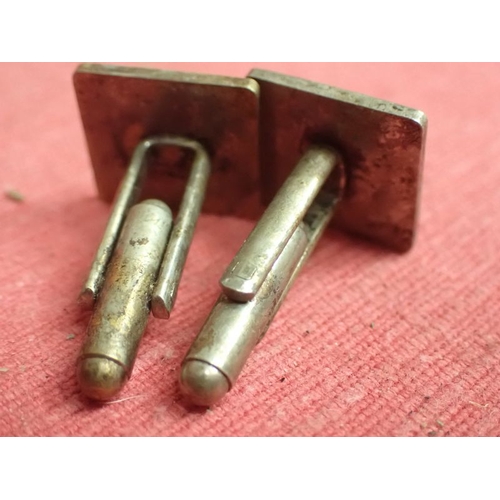 198 - WW2 German, Pair of SS cufflinks

Rare private purchase cufflinks. Nickel-silver with black enamel. ... 