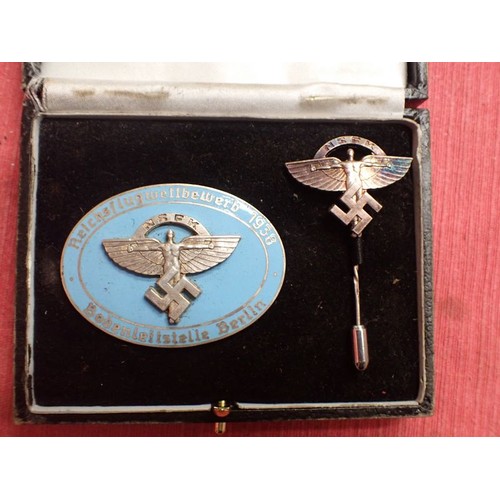 8 - Cased WW2 German NSFK bdge with stick pin

Rare to find, cased 1938 NSFK badge. Convex two part badg... 
