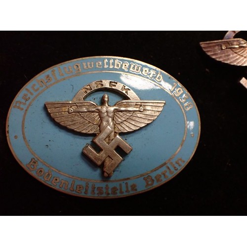 8 - Cased WW2 German NSFK bdge with stick pin

Rare to find, cased 1938 NSFK badge. Convex two part badg... 