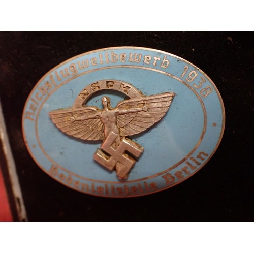 8 - Cased WW2 German NSFK bdge with stick pin

Rare to find, cased 1938 NSFK badge. Convex two part badg... 