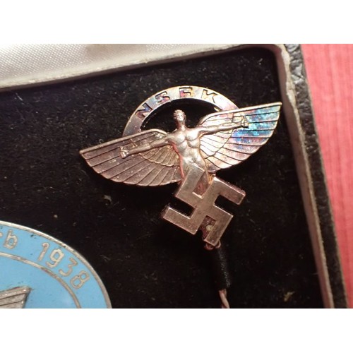 8 - Cased WW2 German NSFK bdge with stick pin

Rare to find, cased 1938 NSFK badge. Convex two part badg... 