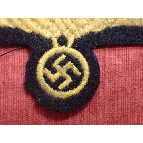 9 - WW2 German Kriegsmarine breast eagle

Stitched eagle on woollen backing. 104 mm across. Couple of li... 
