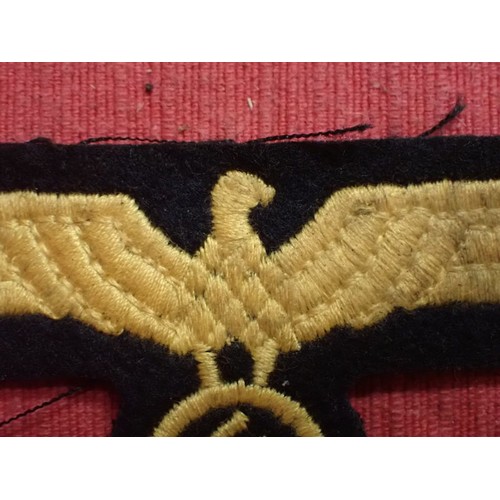 9 - WW2 German Kriegsmarine breast eagle

Stitched eagle on woollen backing. 104 mm across. Couple of li... 
