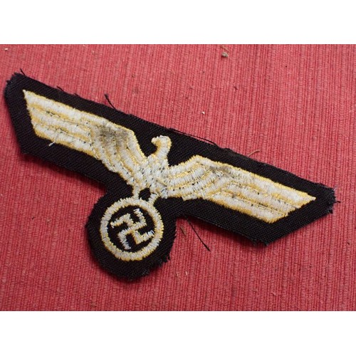 9 - WW2 German Kriegsmarine breast eagle

Stitched eagle on woollen backing. 104 mm across. Couple of li... 