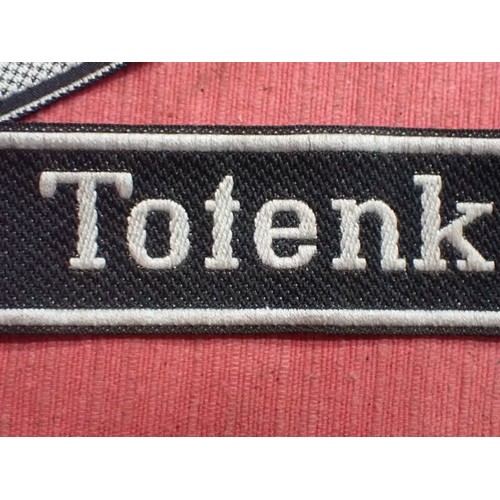 10 - WW2 Waffen-SS Totenkopf Division cuff title

In excellent clean condition. Slight fraying to the end... 