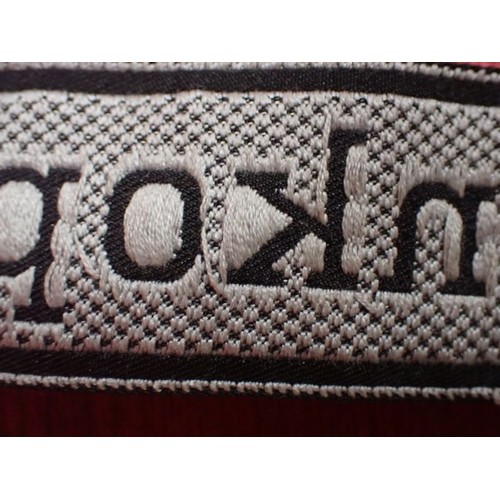 10 - WW2 Waffen-SS Totenkopf Division cuff title

In excellent clean condition. Slight fraying to the end... 